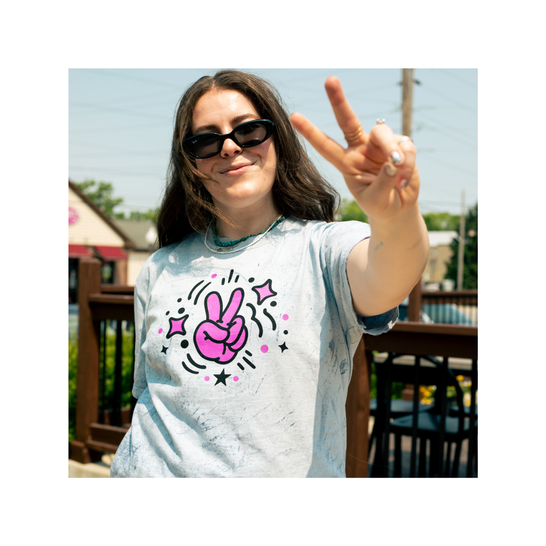 girl doing peace sign